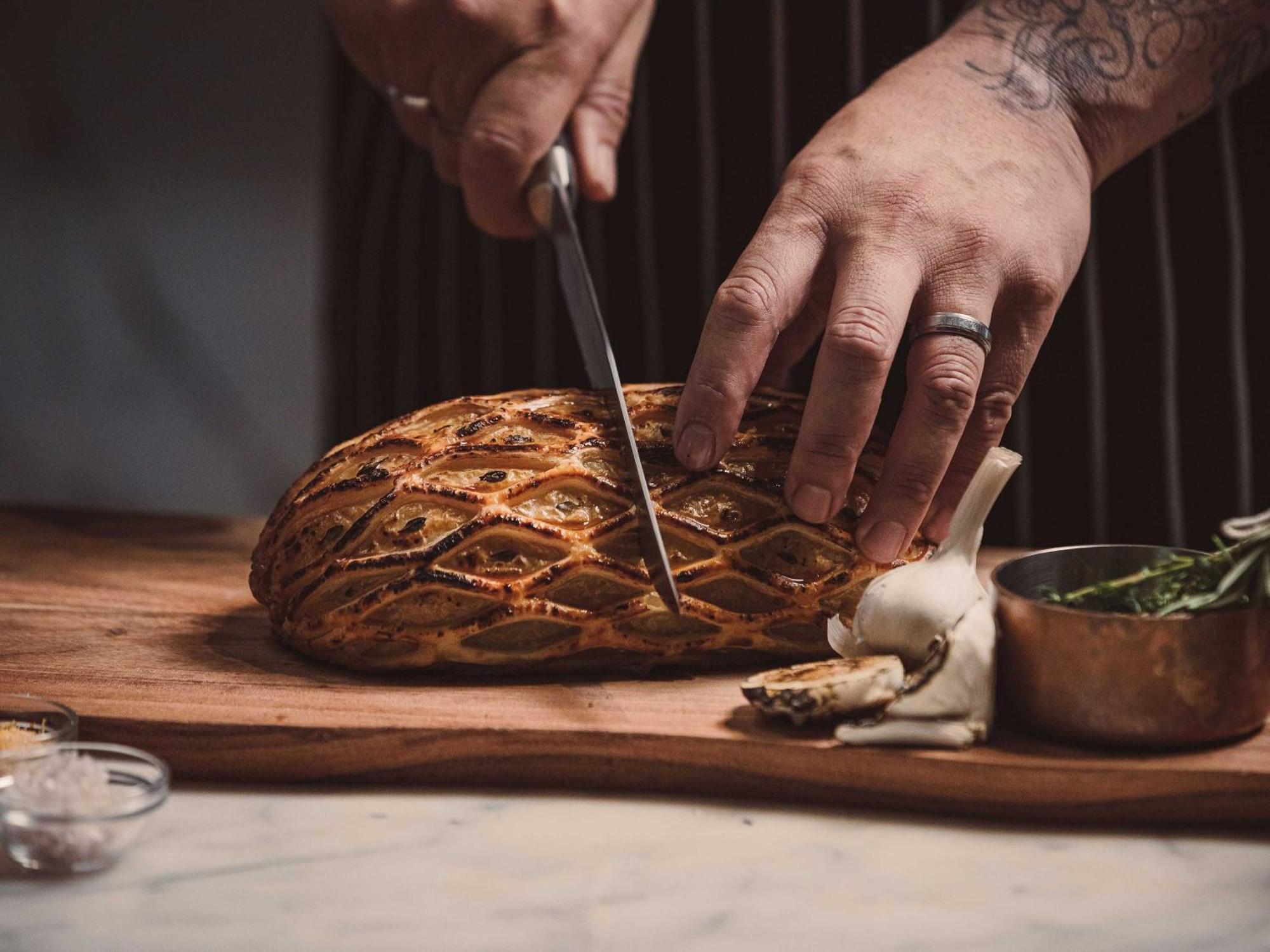 Horizon By Skycity Auckland Exterior photo Chef preparing a whole roasted suckling pig